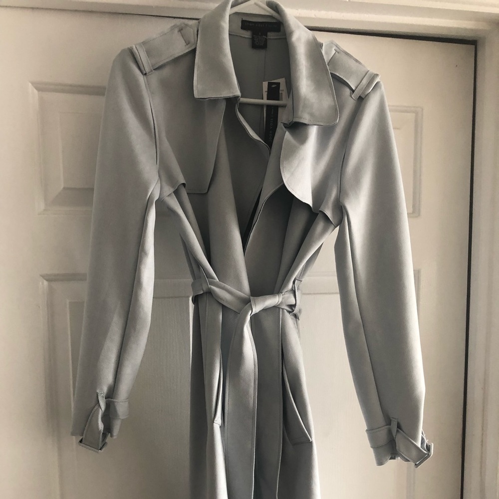 Joan Vas’s trench coat.